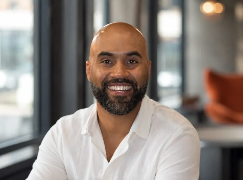 Portrait of a smiling man in a white shirt