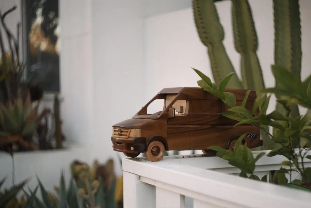 Wooden sprinter van near plants