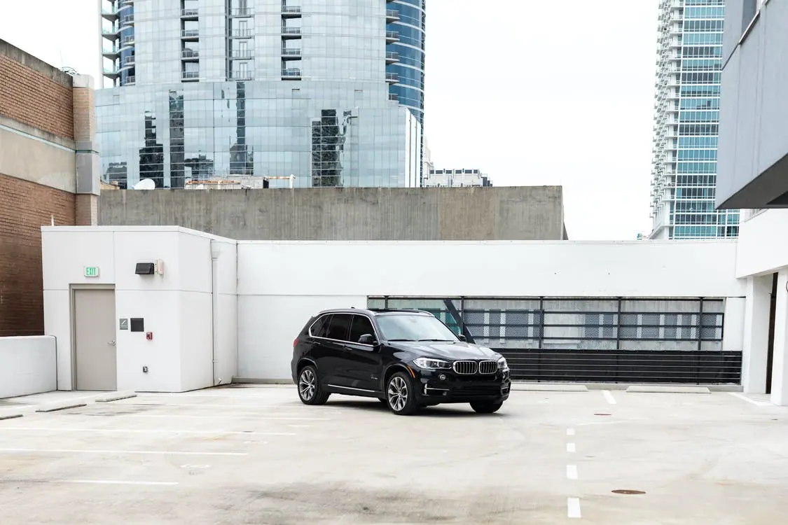 Black SUV parked in an empty lot