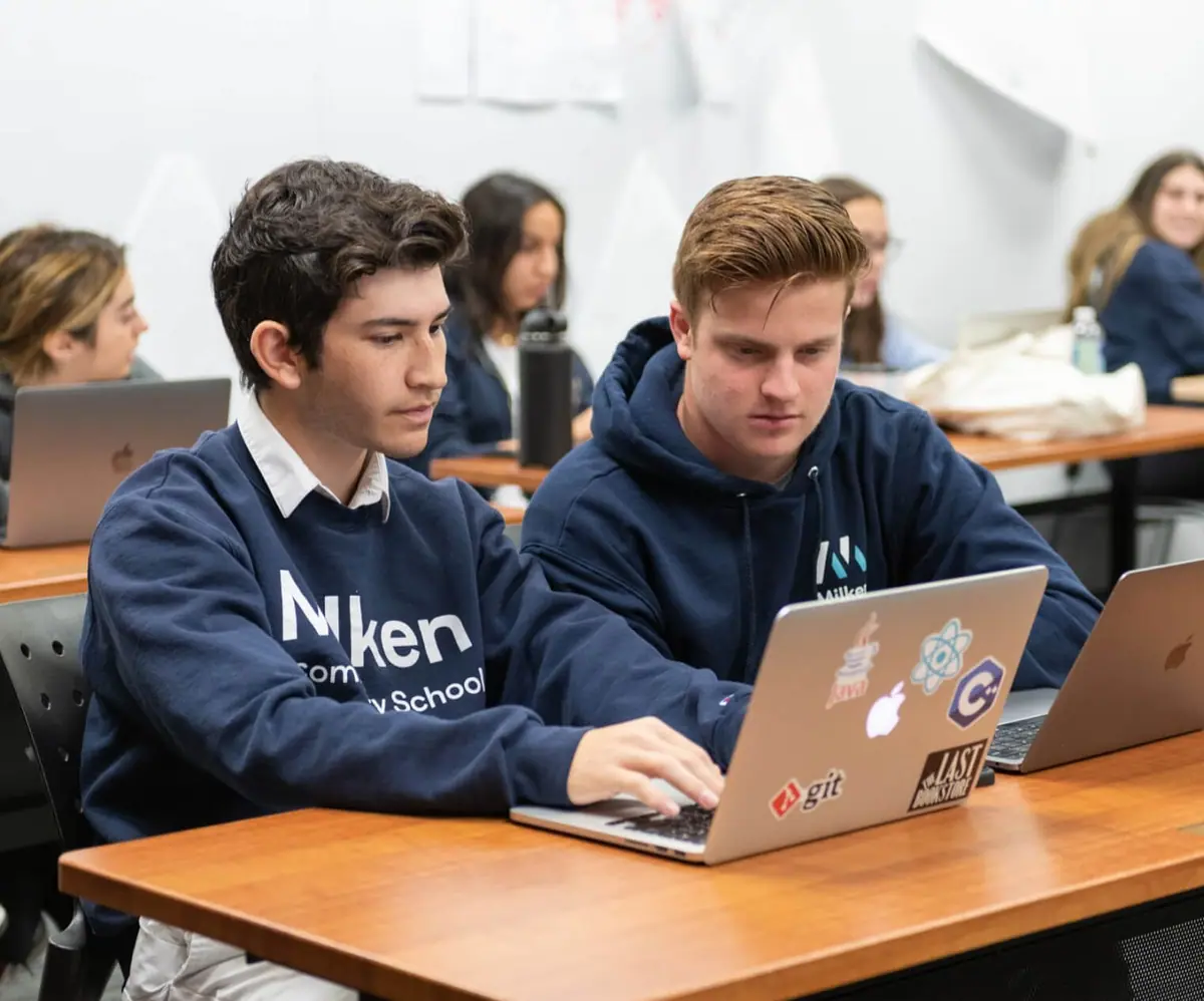 Milken Community School students working on laptops
