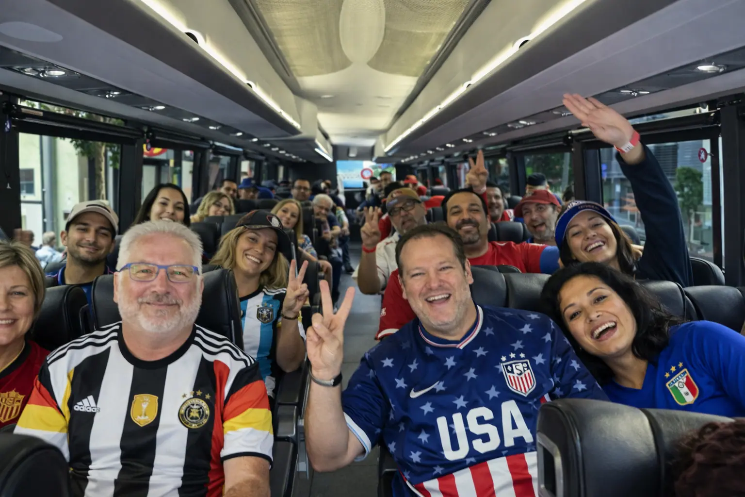 Soccer fans cheering on board a charter bus